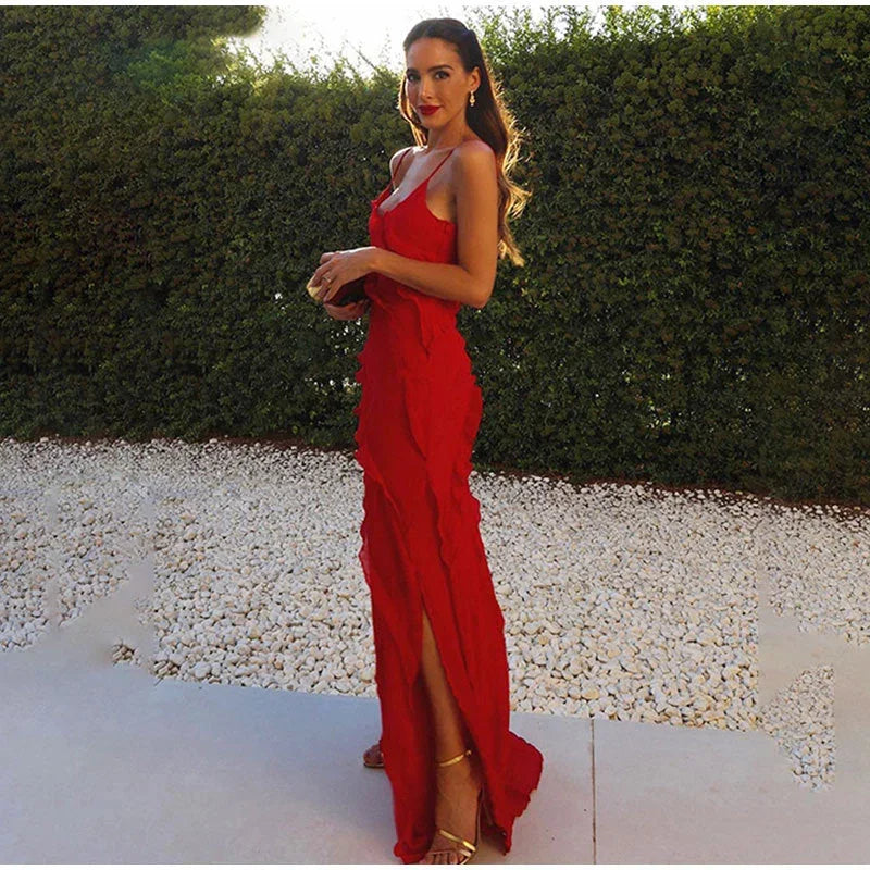 Women's asymmetrical ruffle maxi dress with spaghetti straps, crafted from soft fabric, featuring a flowing design and…