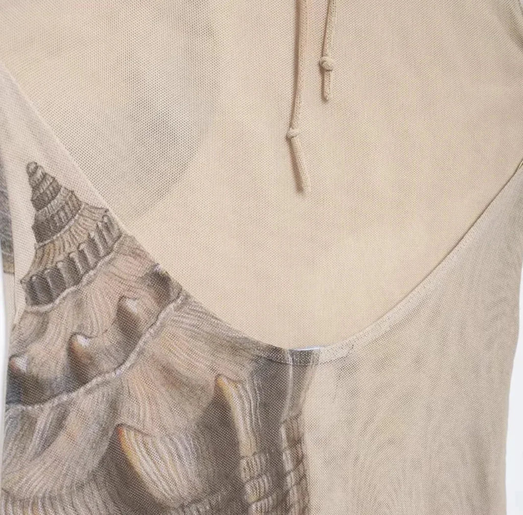 Women’s beige halter maxi dress featuring a shell print design, crafted from lightweight, breathable fabric for comfort.