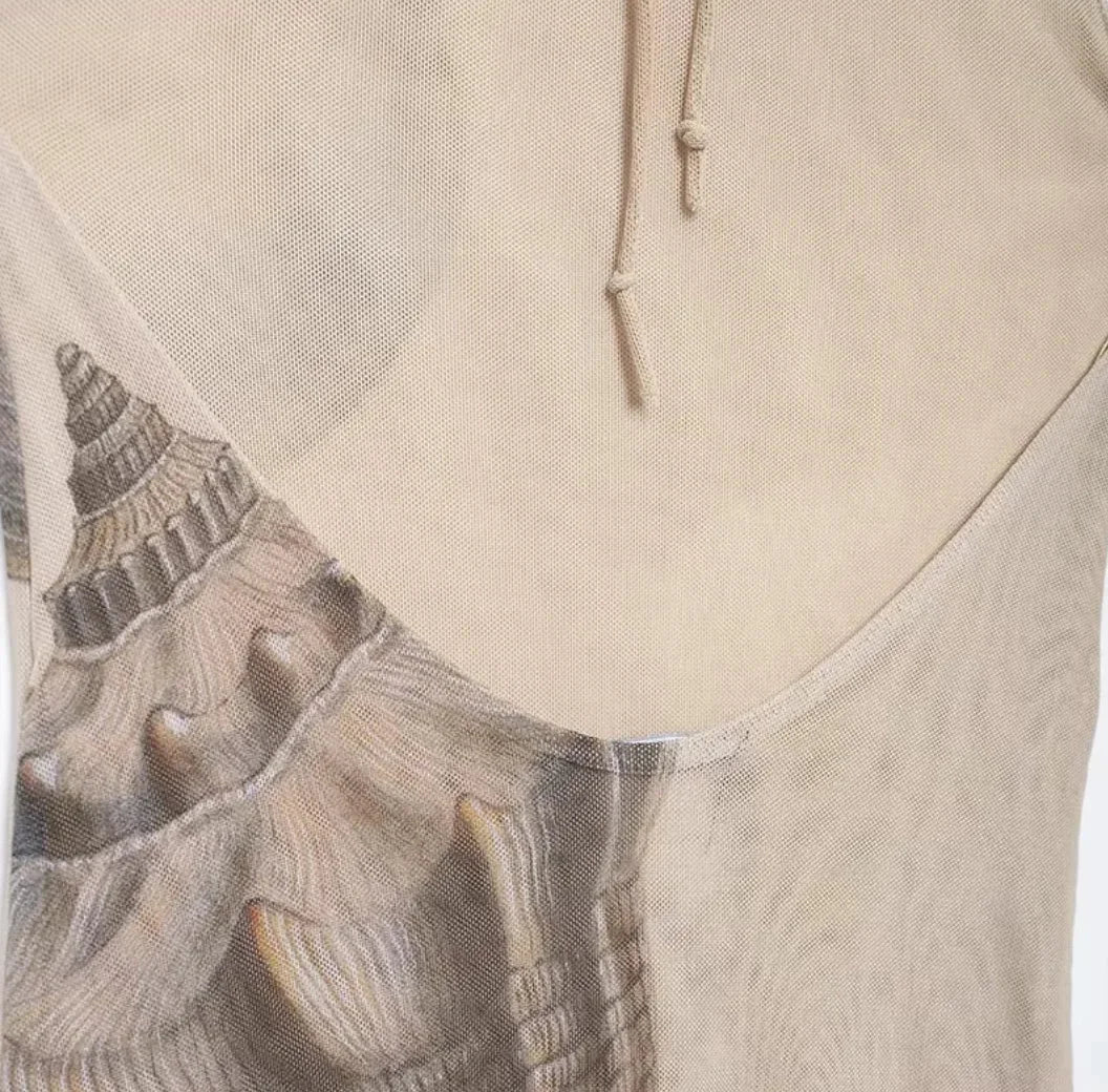 Women’s beige halter maxi dress featuring a shell print design, crafted from lightweight, breathable fabric for comfort.