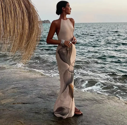Women's beige halter maxi dress featuring a shell print, made from soft, breathable fabric for comfort and style.