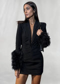 Women’s black mini dress featuring textured faux fur sleeves, made from soft fabric for a stylish and modern look.