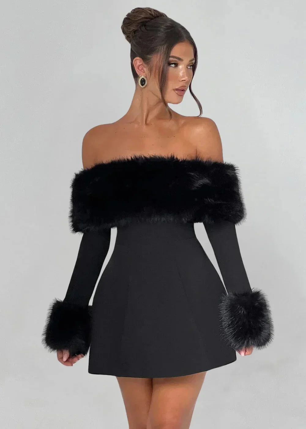 Women’s black off-shoulder mini dress featuring fur details and a fitted design, perfect for casual or evening wear.