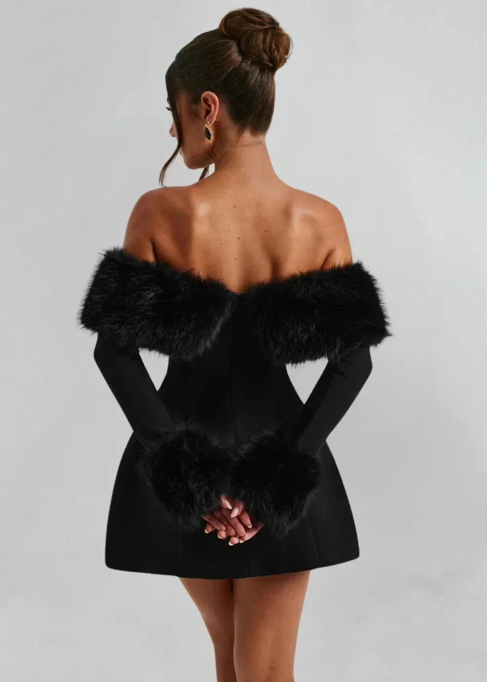 Women’s black off-shoulder mini dress featuring soft fur details, crafted from breathable fabric for a stylish and…