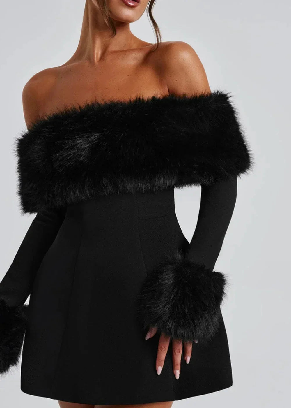 Women’s black off-shoulder mini dress featuring plush fur details, perfect for stylish casual outings or evening events.