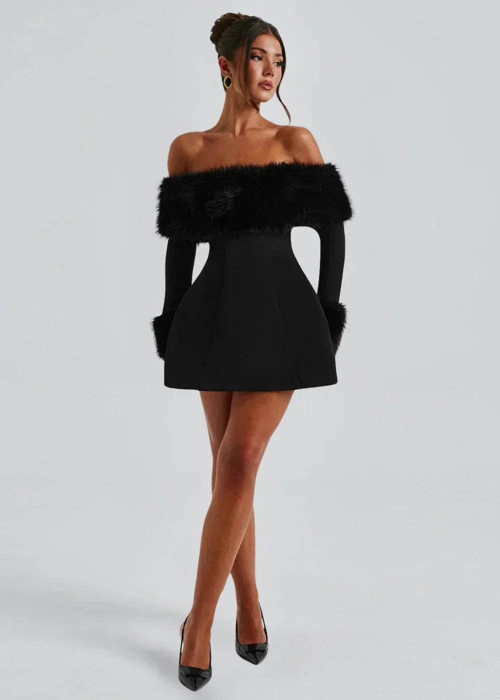 Women’s black off-shoulder mini dress featuring fur details and a sleek design, perfect for casual or semi-formal occasions.