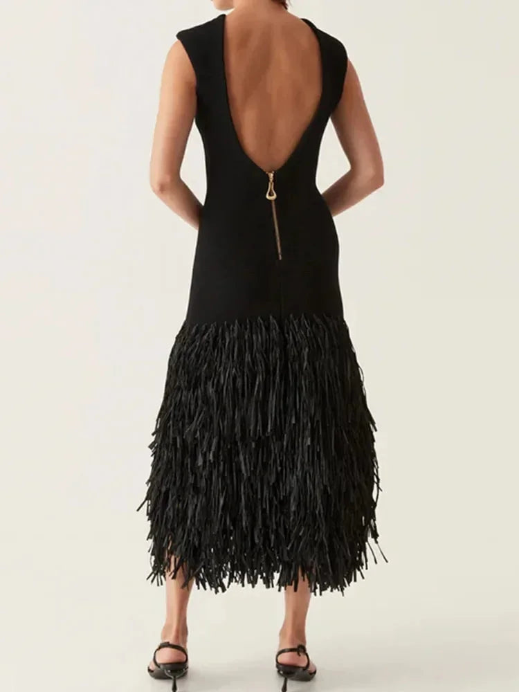 Women’s black sleeveless midi dress featuring fringe accents and soft fabric for a stylish, comfortable fit.