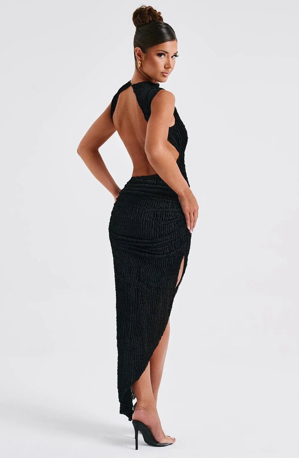 Women’s black sleeveless maxi dress in textured fabric featuring a side cut-out for added style and breathability.