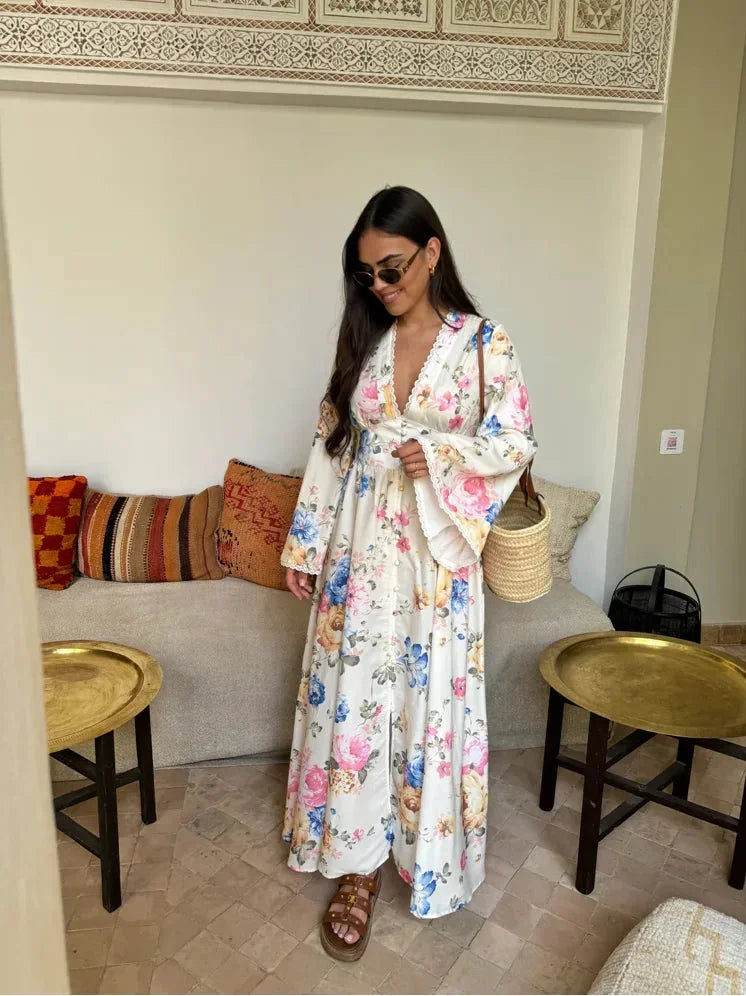 White women’s boho floral maxi dress with long sleeves, featuring a breathable fabric and a flowing silhouette for comfort.