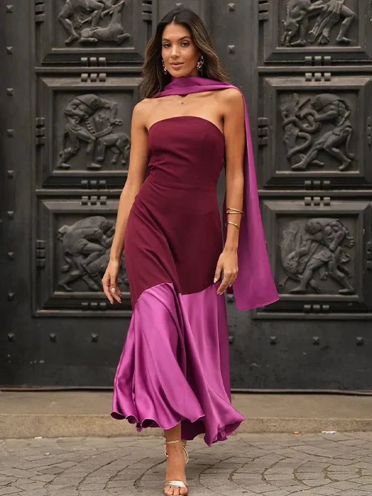 Women’s burgundy and pink strapless asymmetric midi dress made from lightweight fabric, featuring a matching shawl for added…