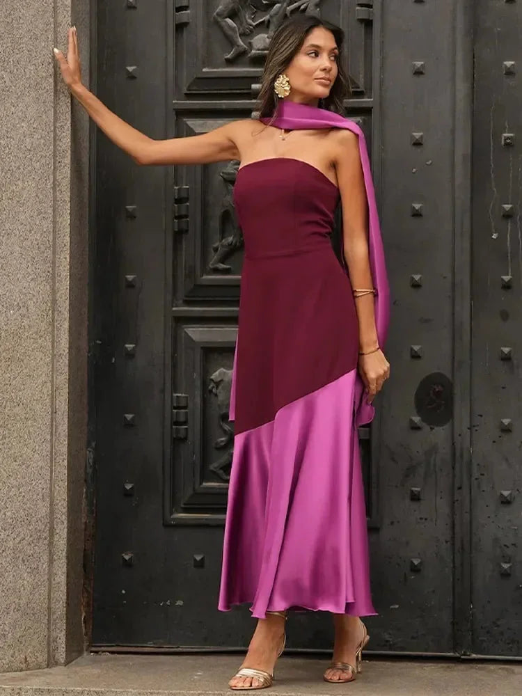 Women's burgundy and pink strapless asymmetric midi dress with shawl, featuring a flowy silhouette and soft fabric for…