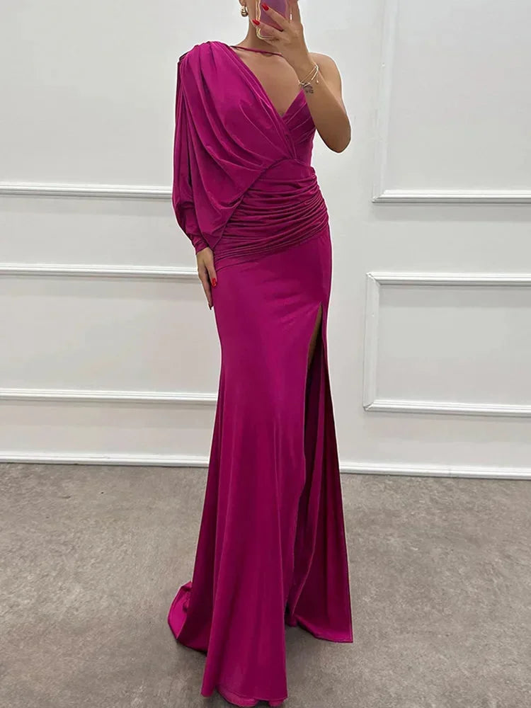 Women’s one-shoulder maxi dress in soft fabric, featuring a draped design and a stylish side slit for added movement.