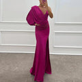 Pink one-shoulder maxi dress made of soft fabric, featuring a draped design and a stylish side slit for added flair.