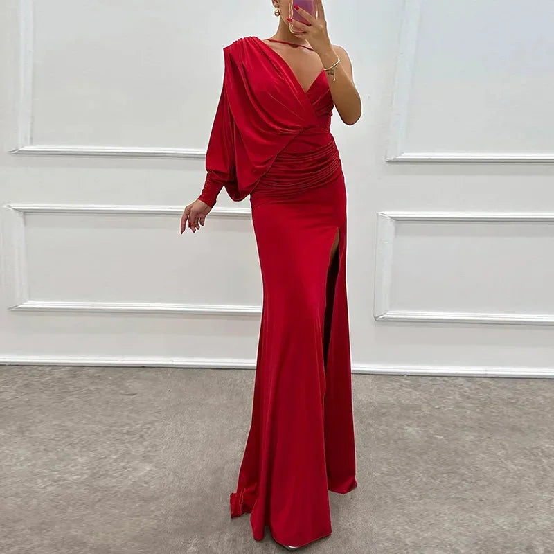 Red one-shoulder maxi dress featuring a draped design, side slit, and soft fabric for a comfortable fit. Perfect for special…