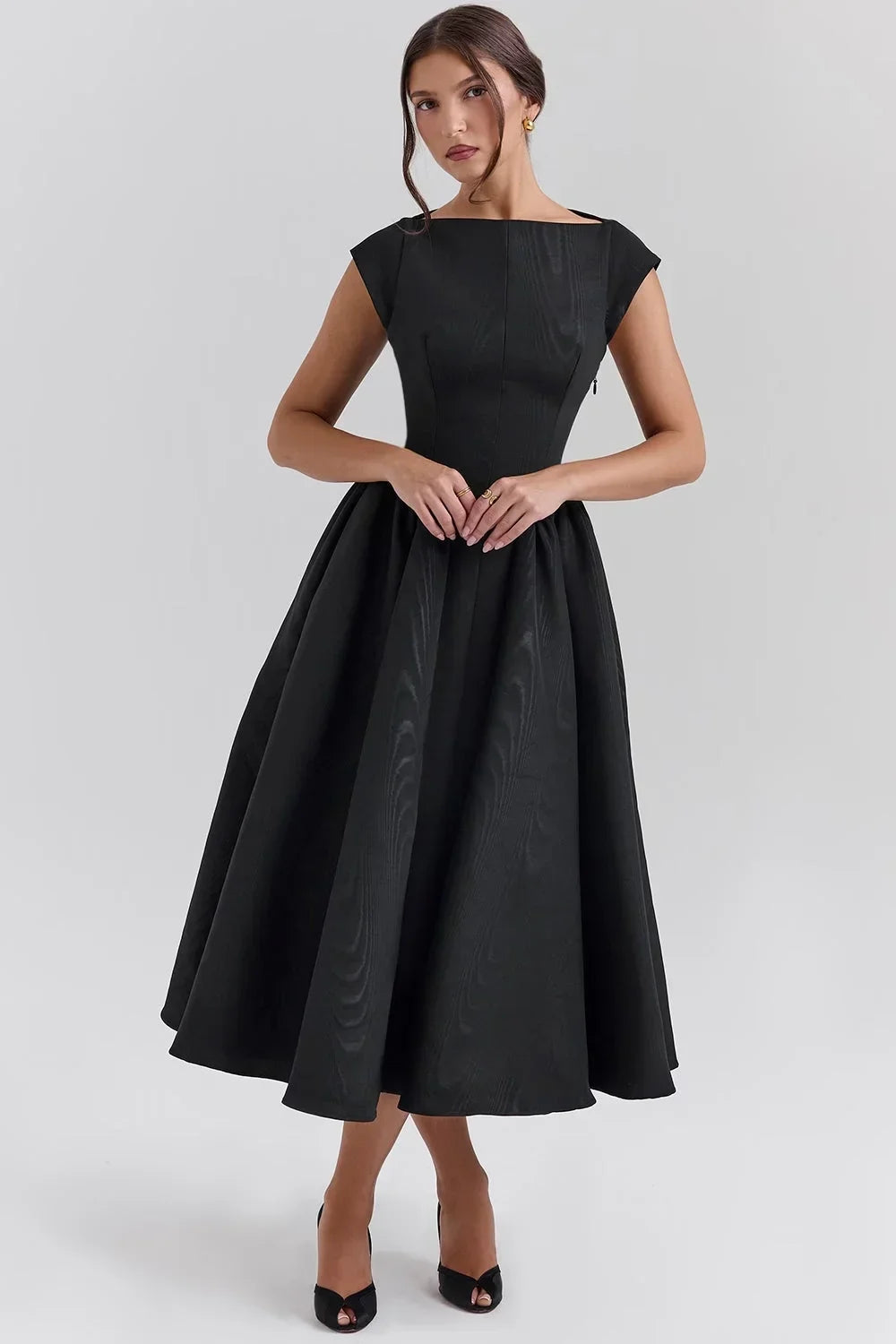 Women’s midi dress with sculpted bodice, cap sleeves, and soft fabric for a flattering silhouette and comfortable fit.
