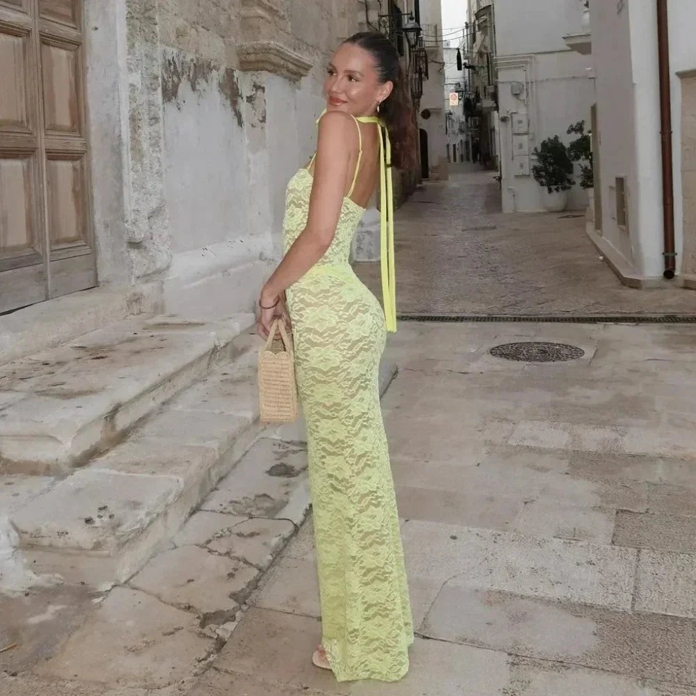 Women's fitted lace maxi dress with spaghetti straps, featuring intricate lace detailing and a flowing silhouette for…