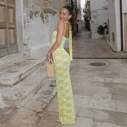 Women's fitted lace maxi dress with spaghetti straps, featuring intricate lace detailing and a flowing silhouette for…