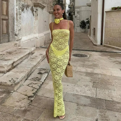 Yellow women's fitted lace maxi dress with spaghetti straps, featuring intricate lace detailing and a flowing silhouette.