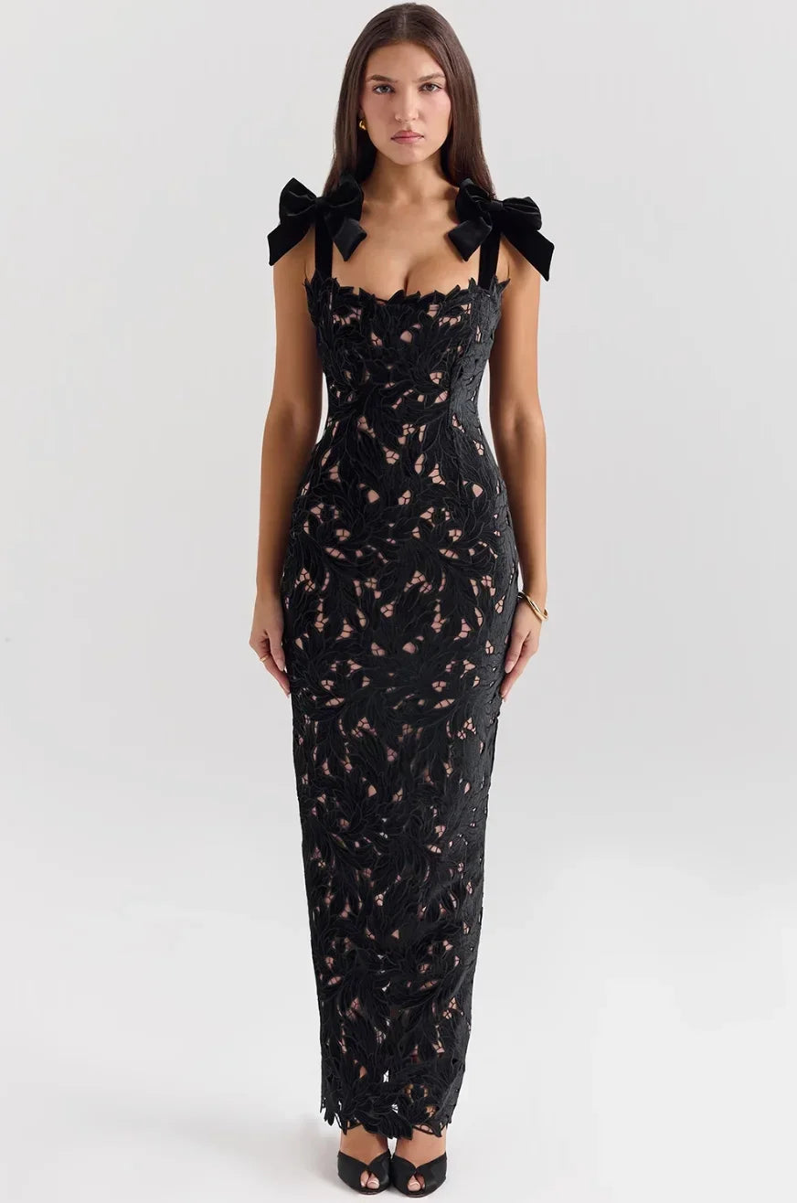 Women's fitted sleeveless lace maxi dress featuring bow straps, crafted from delicate lace with a flowing design for summer…