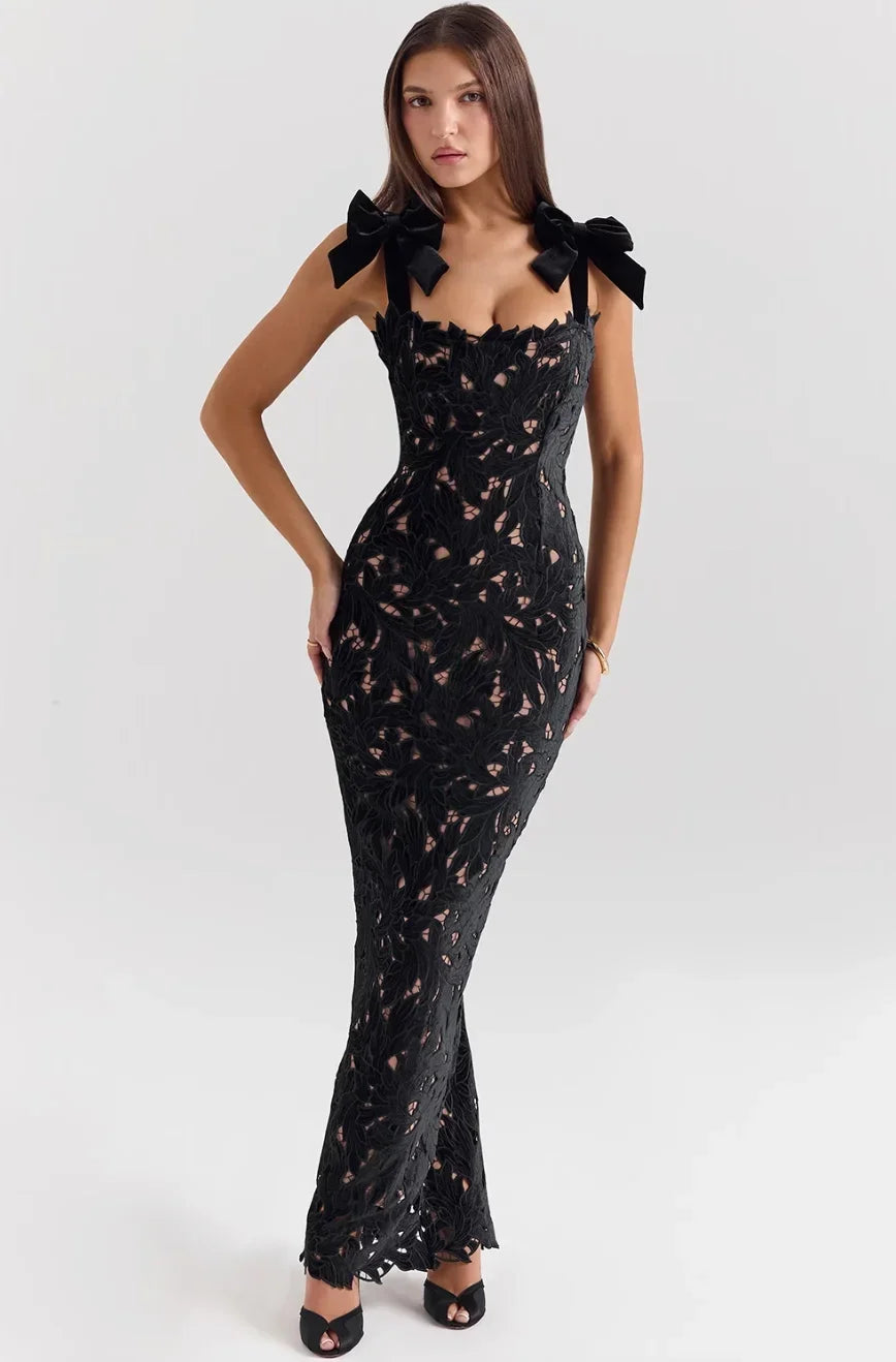 Black sleeveless lace maxi dress for women featuring bow straps and a fitted silhouette, perfect for special occasions.