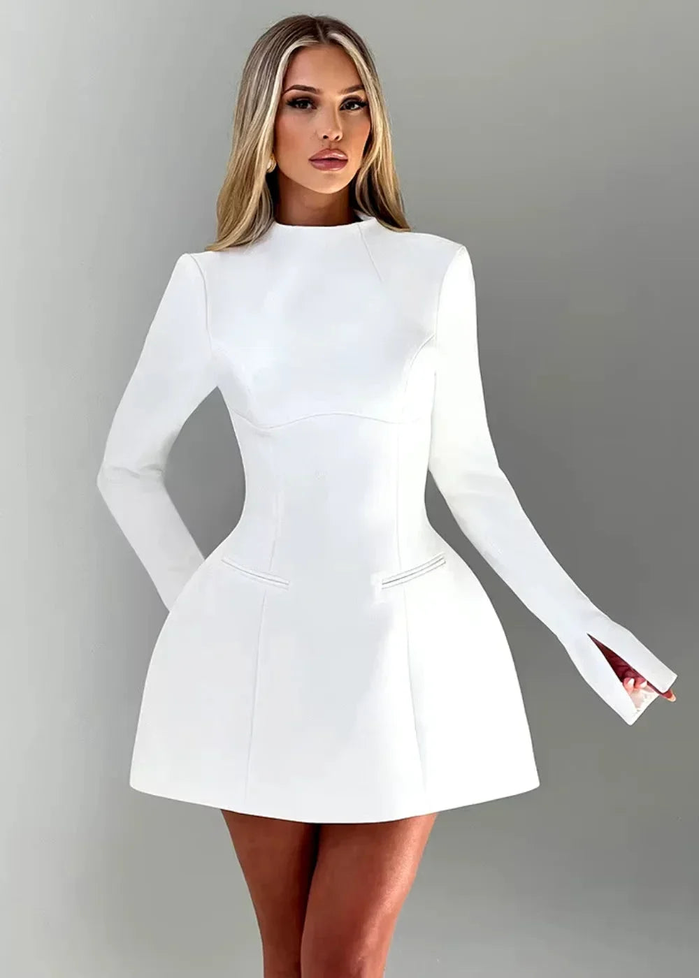 Women's flared mini dress with long sleeves and an open back, made from lightweight fabric for a comfortable fit.