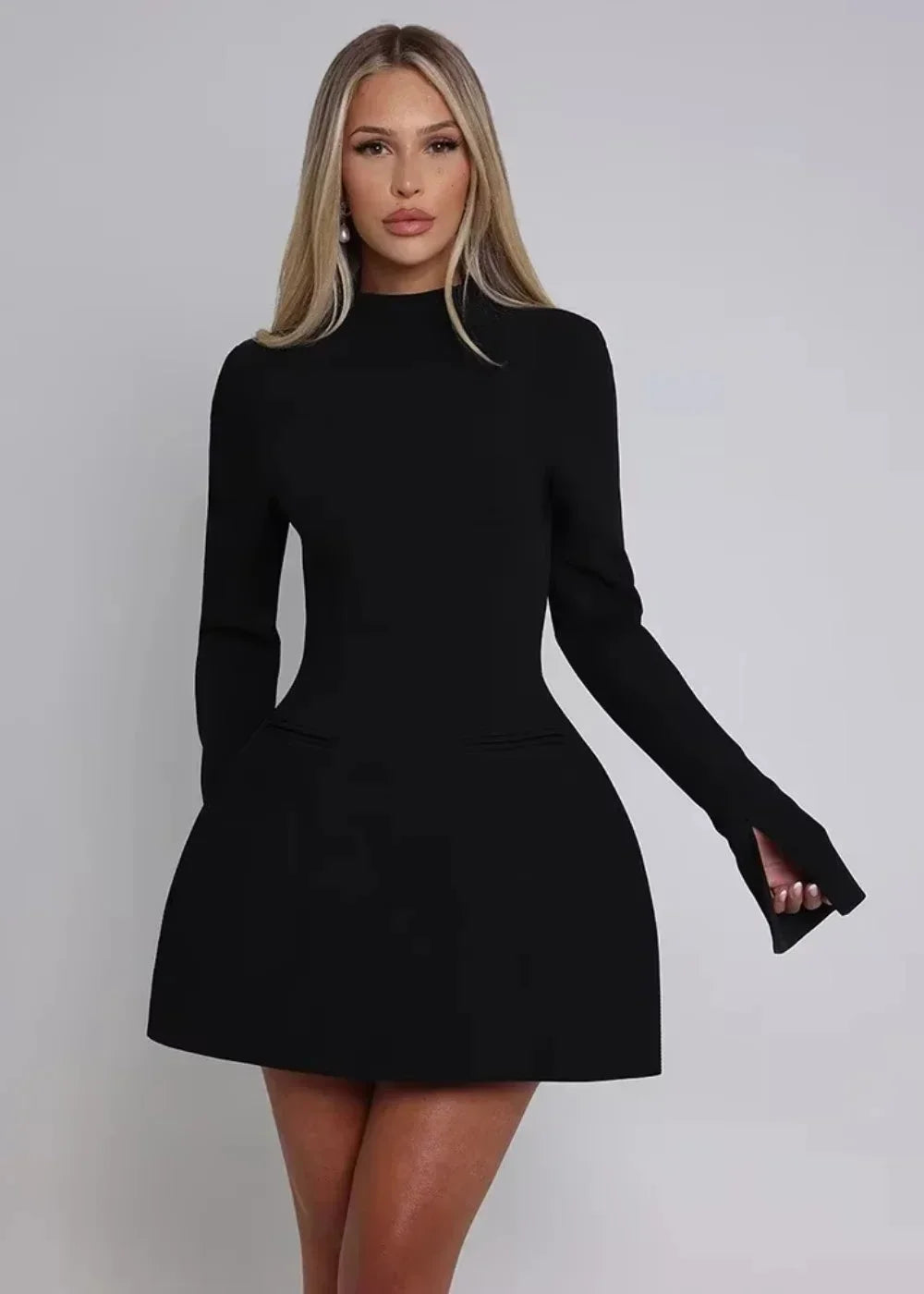 Women’s flared mini dress in soft fabric, featuring long sleeves and an open back design for a stylish, comfortable fit.