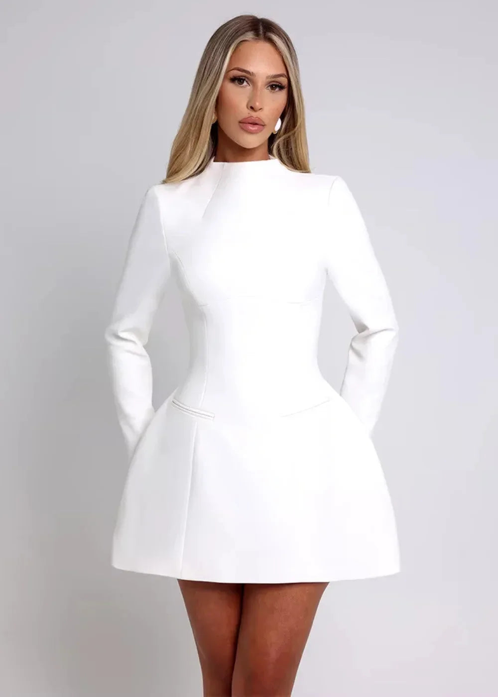 Women’s flared mini dress with long sleeves and an open back, made from soft cotton blend for comfort and style.