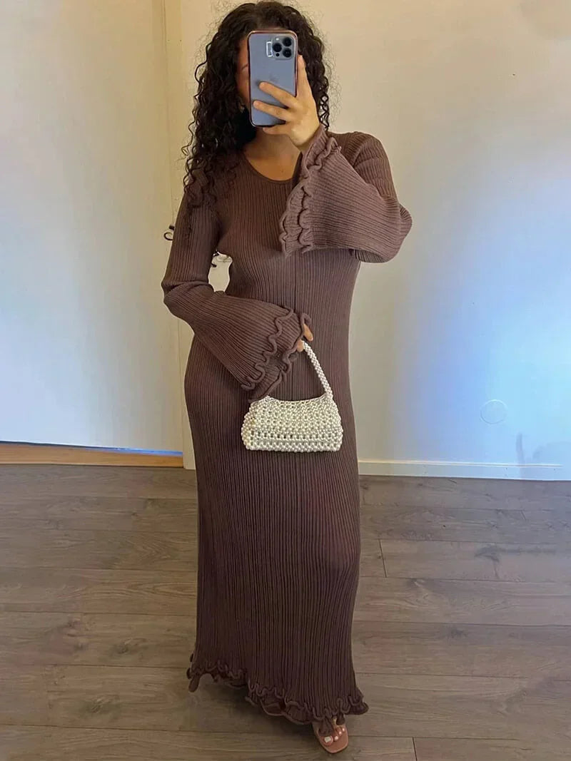 Brown floor-length pleated maxi dress for women featuring flared sleeves and a flowy design, ideal for casual or formal wear.