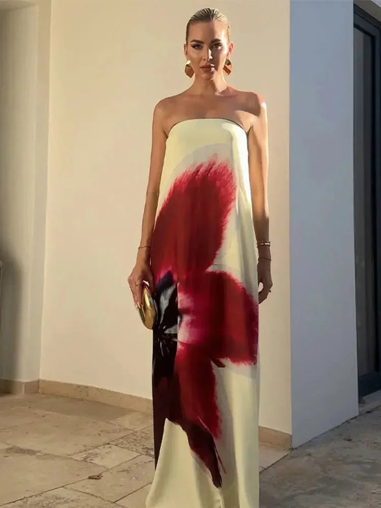 Women’s yellow and red floral beach maxi dress, made of lightweight fabric, features a flowing silhouette and sleeveless…