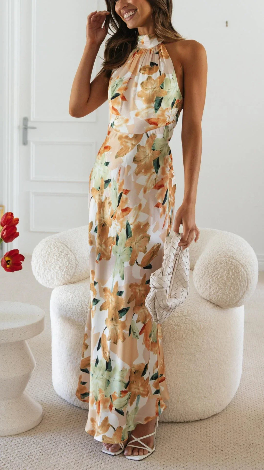 Women's floral maxi dress with a halter neckline, featuring soft cotton fabric and a flowing silhouette perfect for warm…