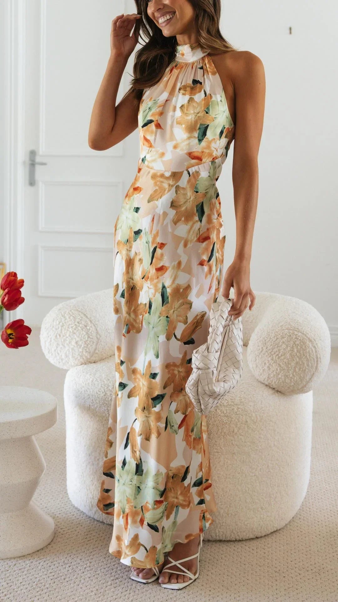 Women's floral maxi dress with a halter neckline, featuring soft cotton fabric and a flowing silhouette perfect for warm…
