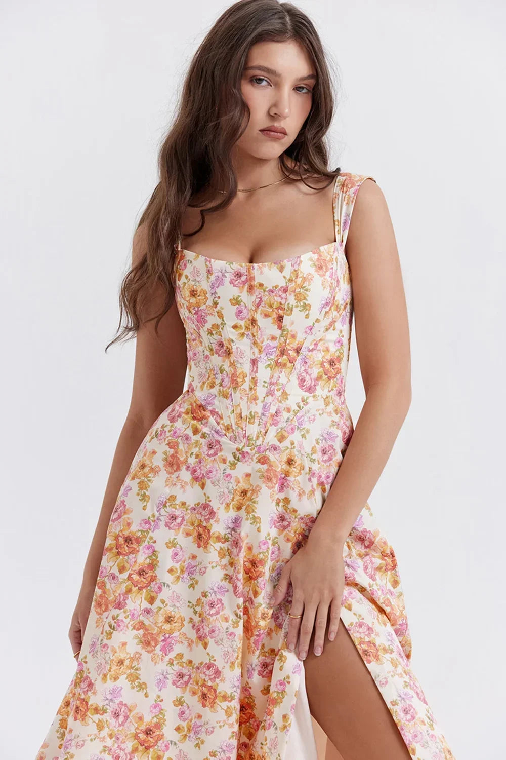 Women's off-shoulder midi dress with a fitted bodice, featuring a vibrant floral pattern made of soft, breathable fabric.