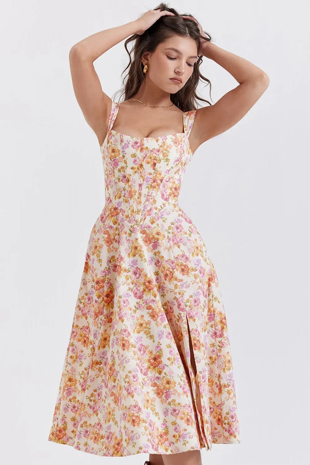 Women’s floral off-shoulder midi dress featuring a fitted bodice and lightweight fabric, perfect for warm weather outings.