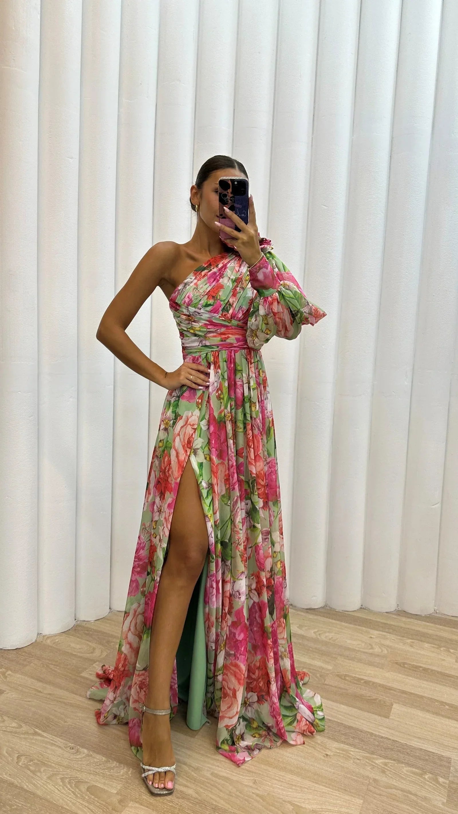 Pink women's floral one-shoulder maxi dress, featuring a flowing design and lightweight fabric, perfect for warm weather.