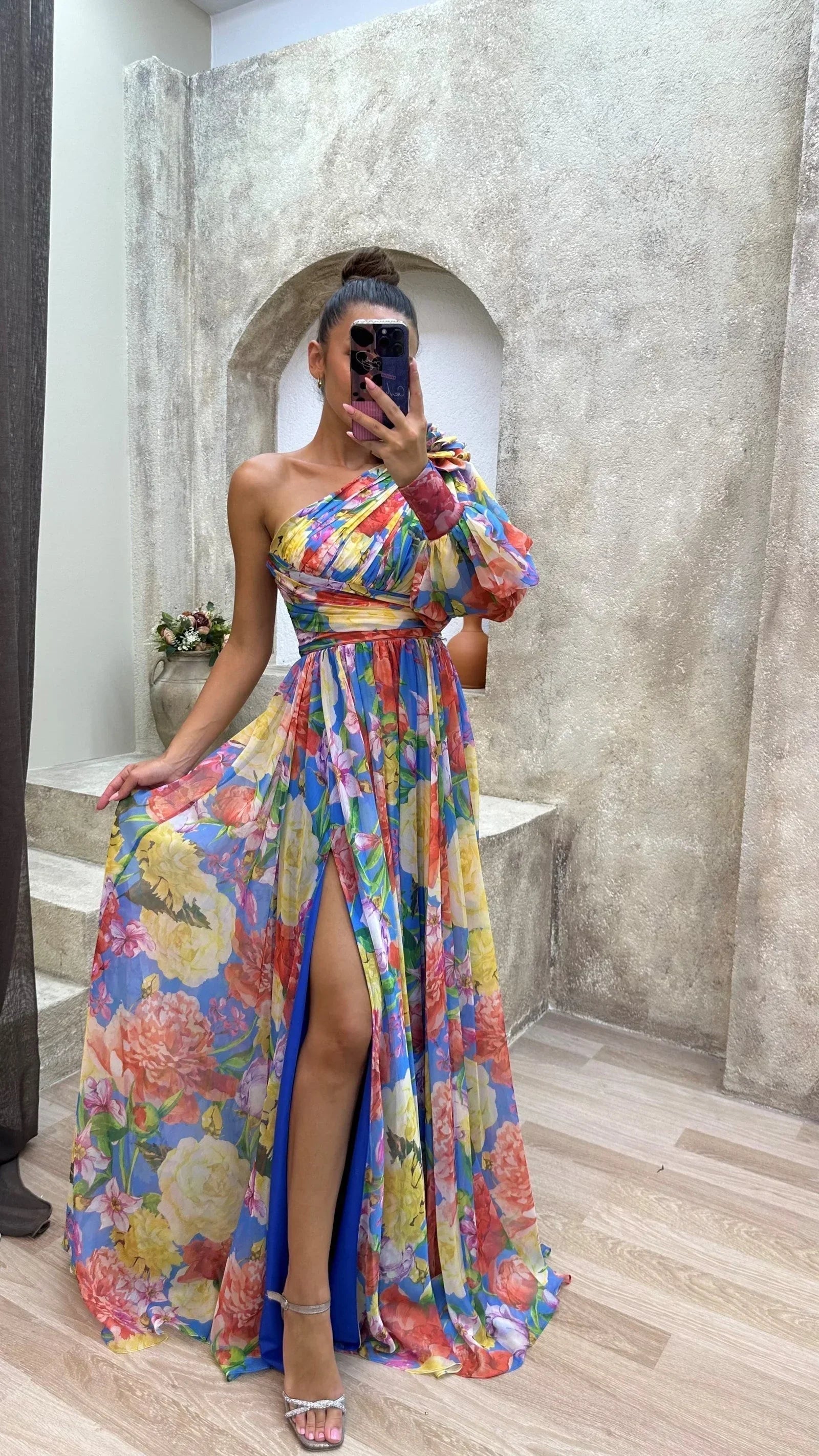 Women’s one-shoulder maxi dress in rainbow floral print, featuring a lightweight, flowing design perfect for warm weather…