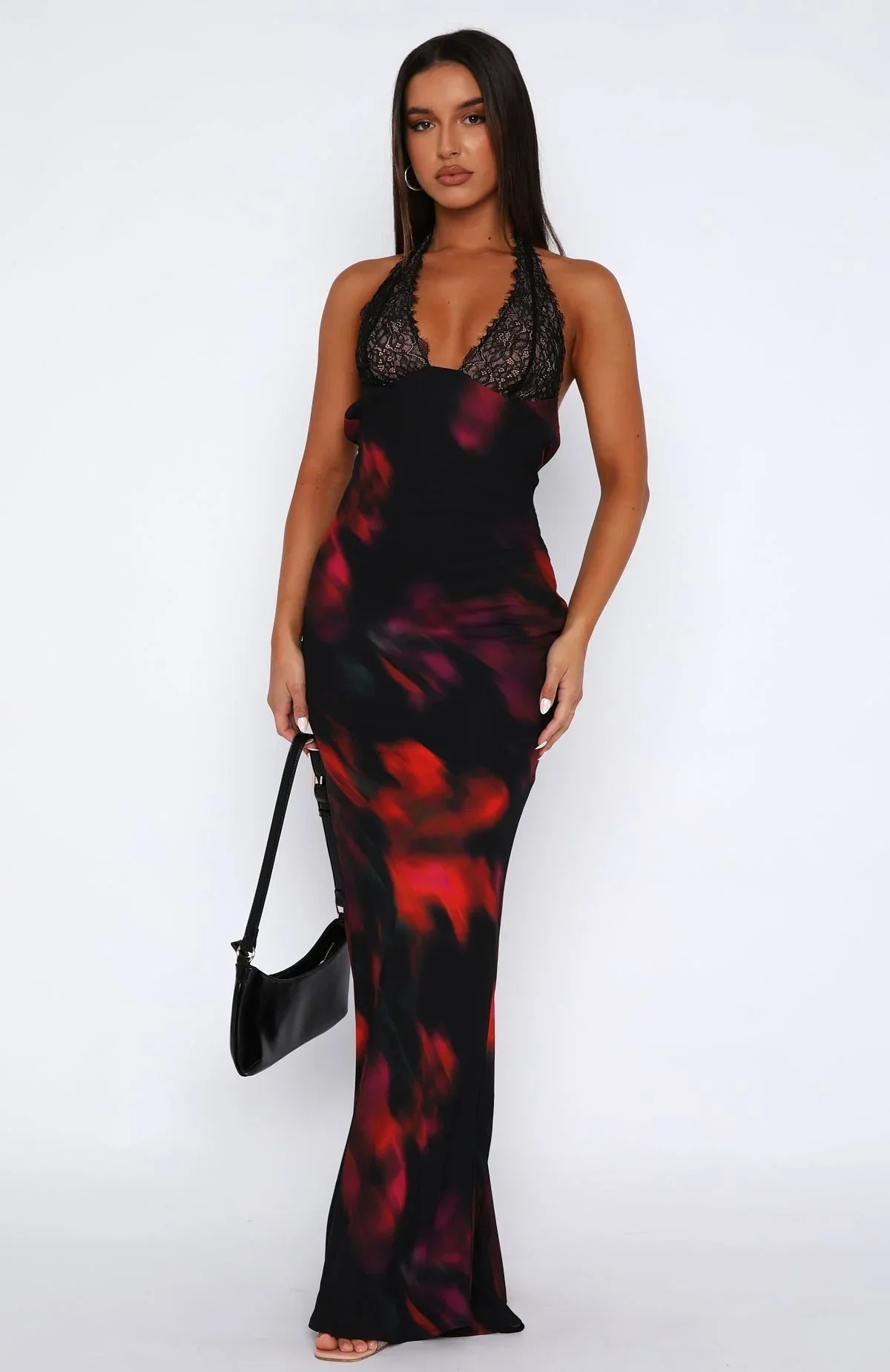 Floral print maxi dress with a lace halter neck, made from lightweight fabric, perfect for warm weather occasions.