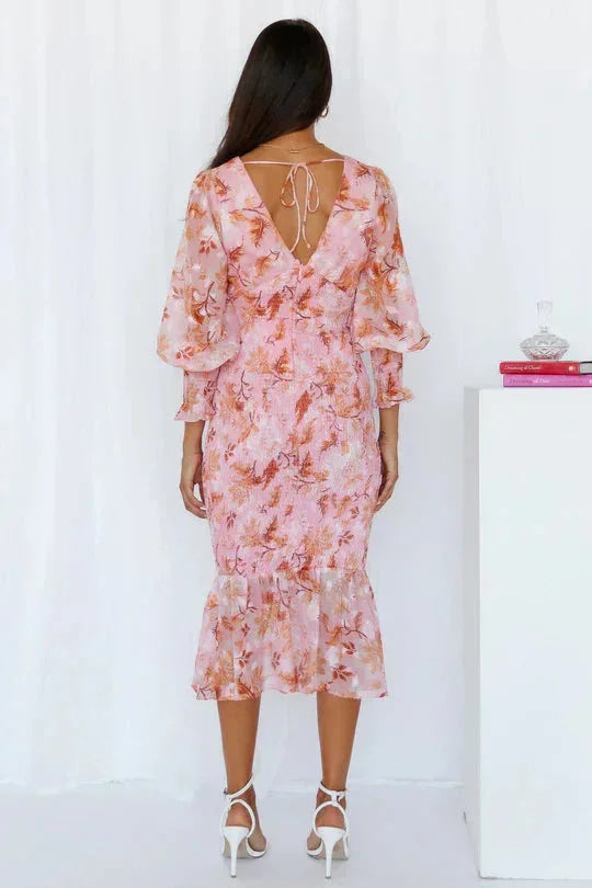 Women’s floral sheer midi dress featuring puffed sleeves and a lightweight fabric, perfect for warm-weather outings.