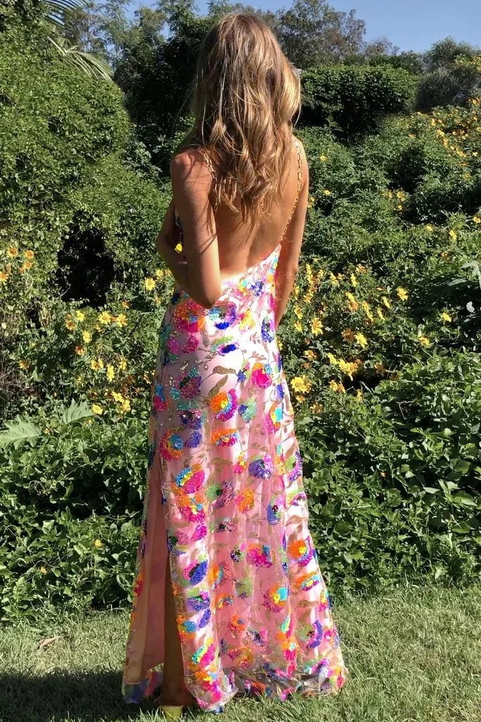 Women’s floral sheer maxi dress featuring a lightweight fabric, vibrant prints, and a stylish side slit for added elegance.