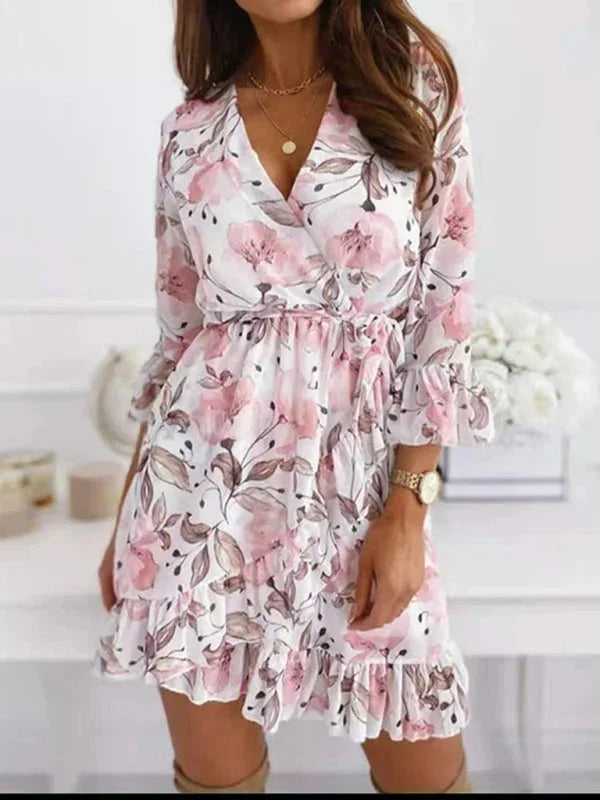 Women’s floral v-neck mini dress with ruffle sleeves, made of lightweight cotton, featuring a playful floral print and…