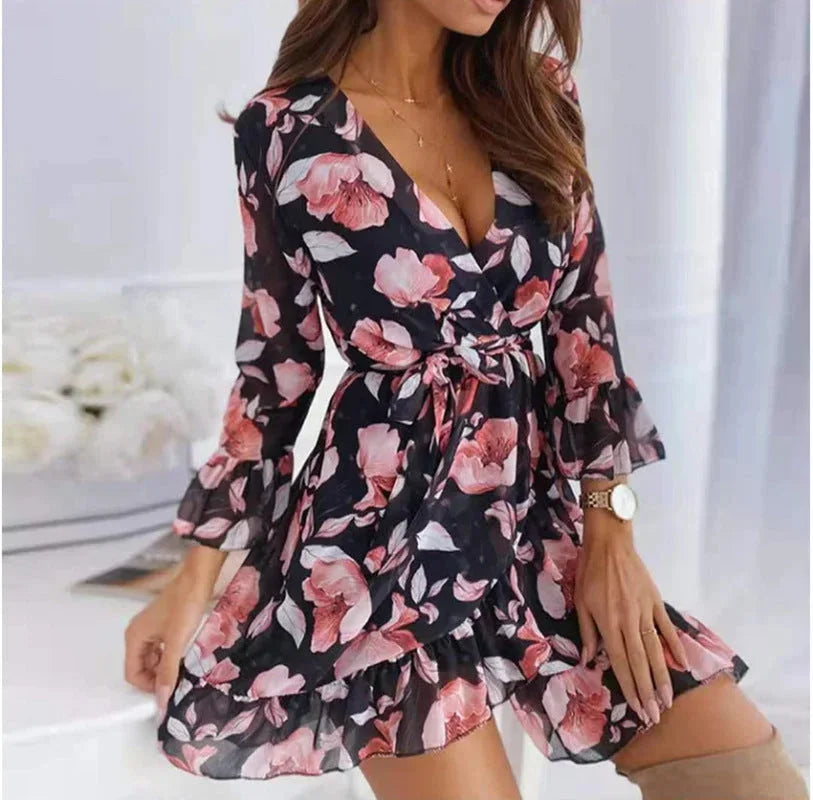 Black women's floral v-neck mini dress featuring ruffle sleeves and a lightweight fabric for comfort and breathability.