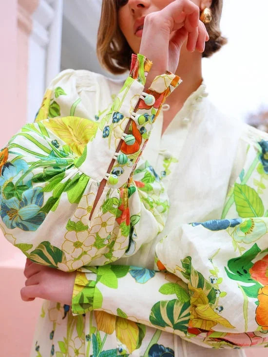 Floral midi shirt dress for women featuring flowy design and puffy sleeves, crafted from lightweight, breathable fabric.