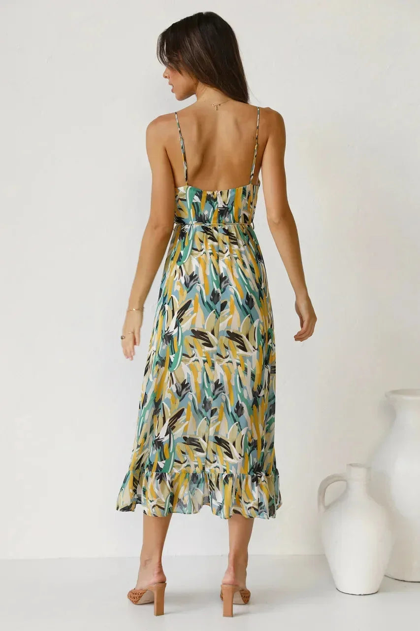 Flowy spaghetti strap maxi dress for women, made of lightweight fabric with an abstract print, perfect for warm-weather…