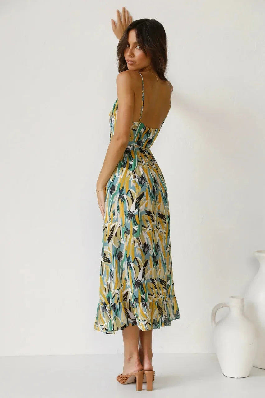 Flowy spaghetti strap maxi dress for women in abstract print, made from lightweight fabric for comfort and breathability.