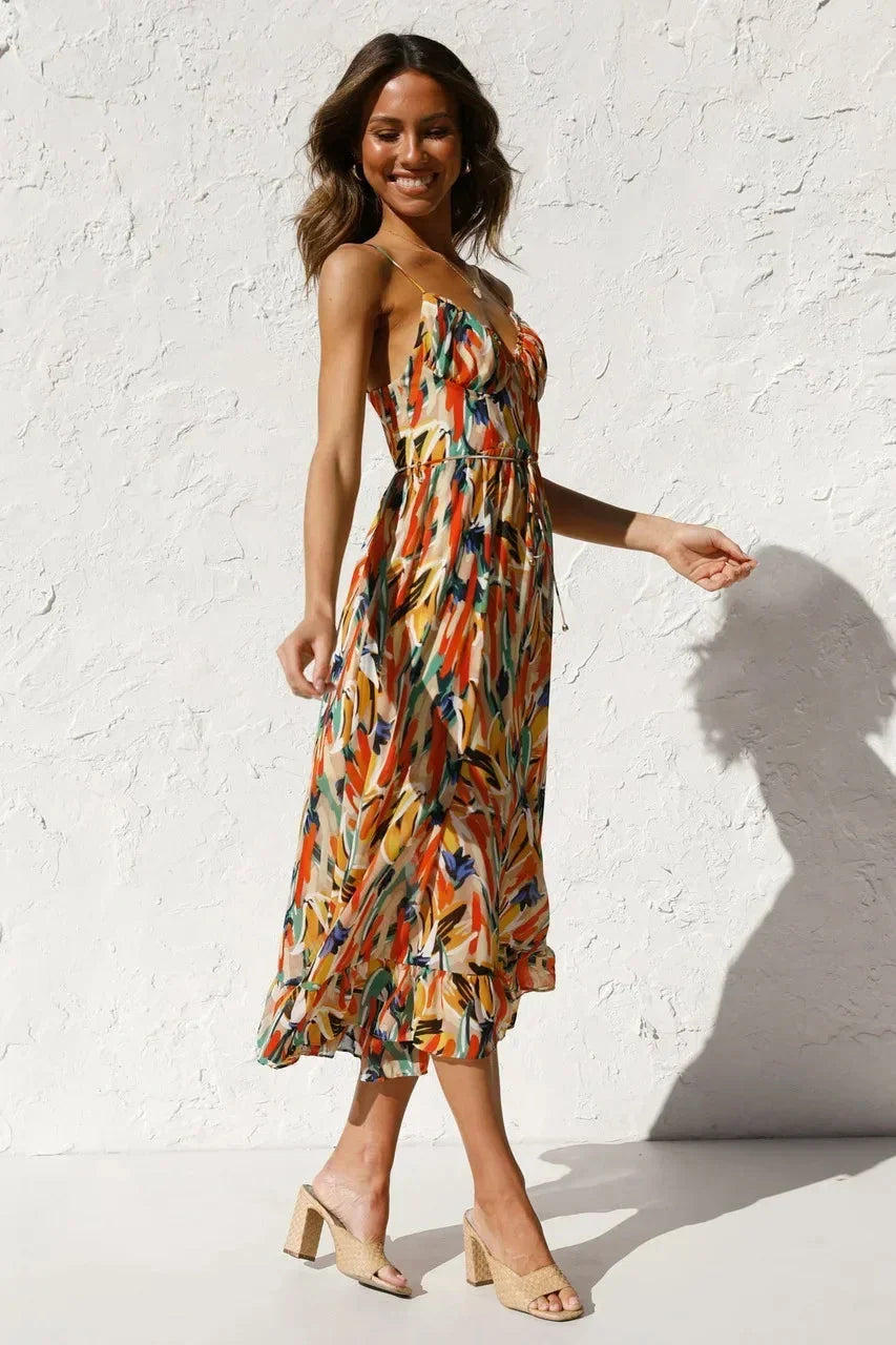 Lightweight maxi dress with spaghetti straps featuring an abstract print in soft fabric, perfect for warm weather outings.