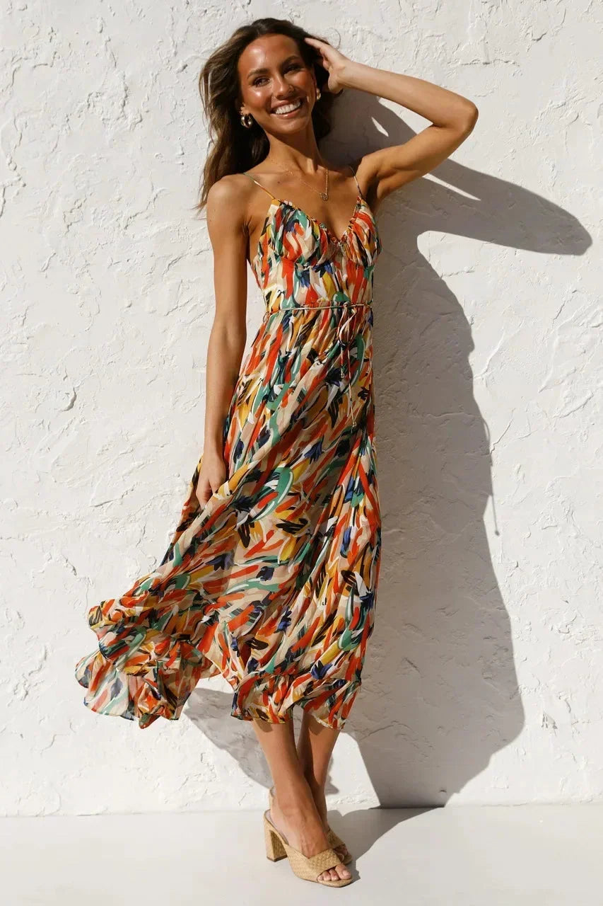 Women’s flowy spaghetti strap maxi dress in breathable fabric, featuring an eye-catching abstract print and a relaxed fit.