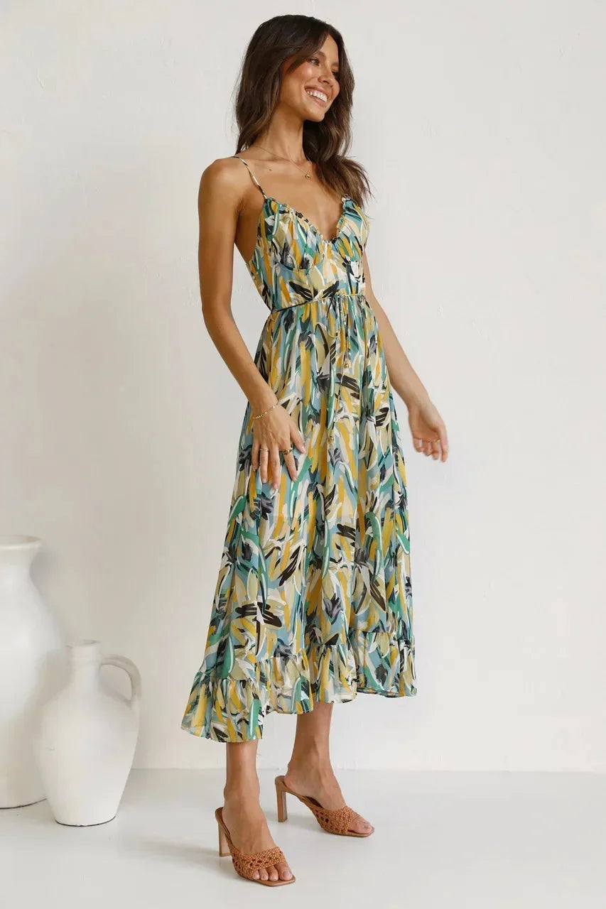 Women’s flowy maxi dress with spaghetti straps, featuring an abstract print in lightweight, breathable fabric for comfort.