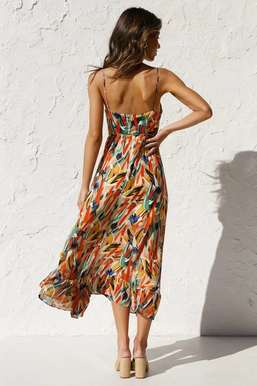 Women's flowy spaghetti strap maxi dress featuring an abstract print, made from soft, breathable fabric for comfortable wear.