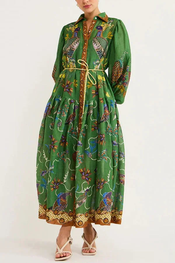 Women’s green midi dress with long sleeves and bird print, made from breathable cotton for comfort and style.