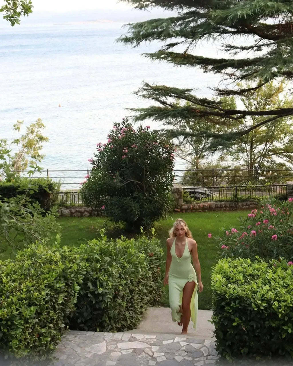 Women's halter neck maxi dress featuring floral detailing, crafted from soft, breathable fabric for comfort and style.