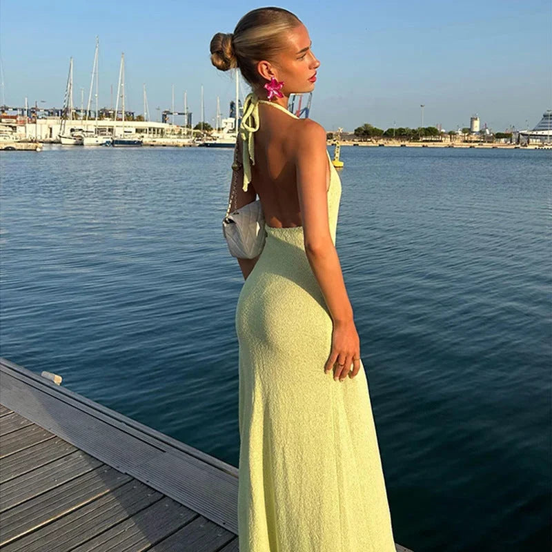 Halter neck maxi dress with floral detailing, made from lightweight fabric for comfort and flow, perfect for warm weather…