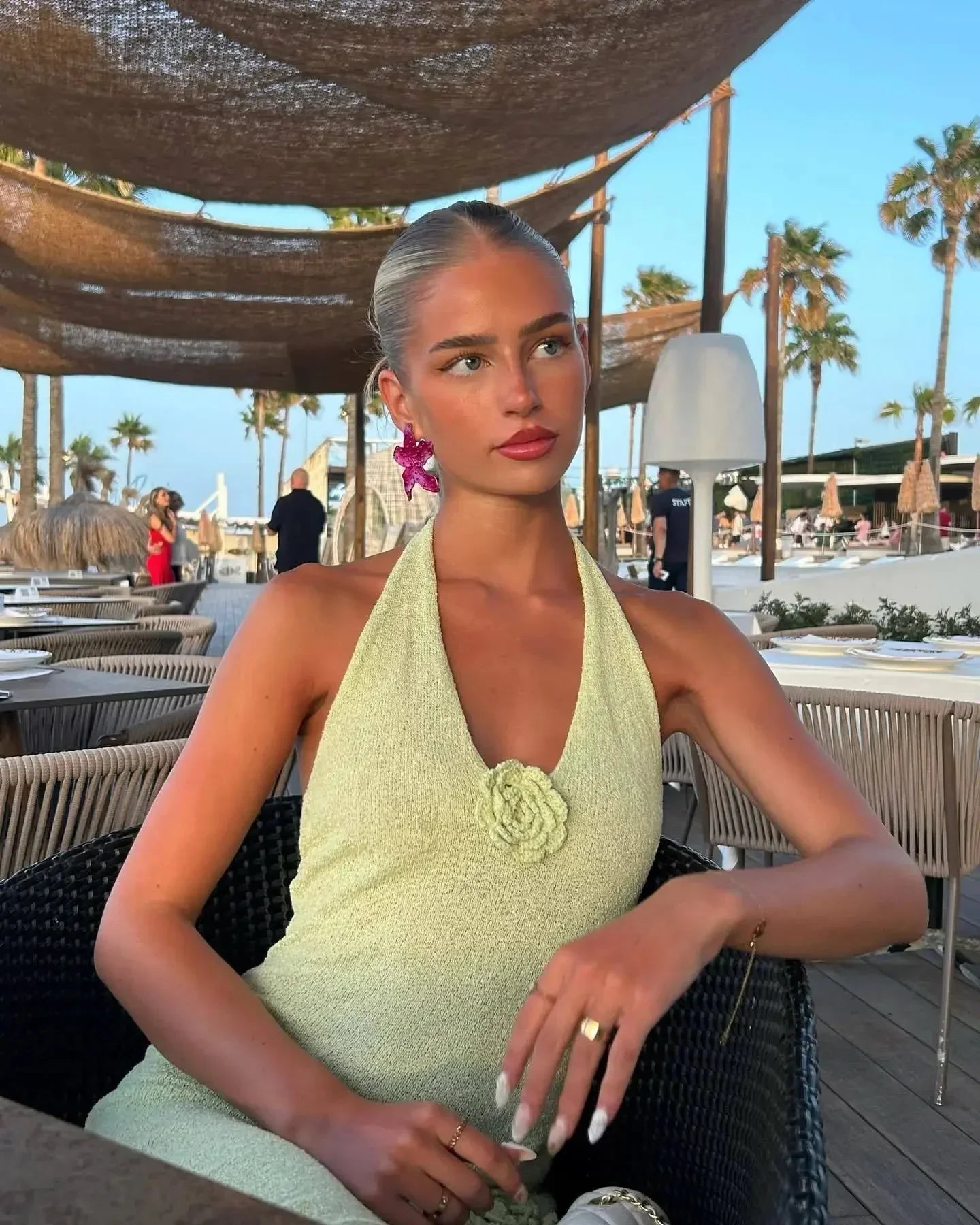 Women's halter neck maxi dress featuring floral detailing, made of lightweight fabric for comfort and flowy movement.